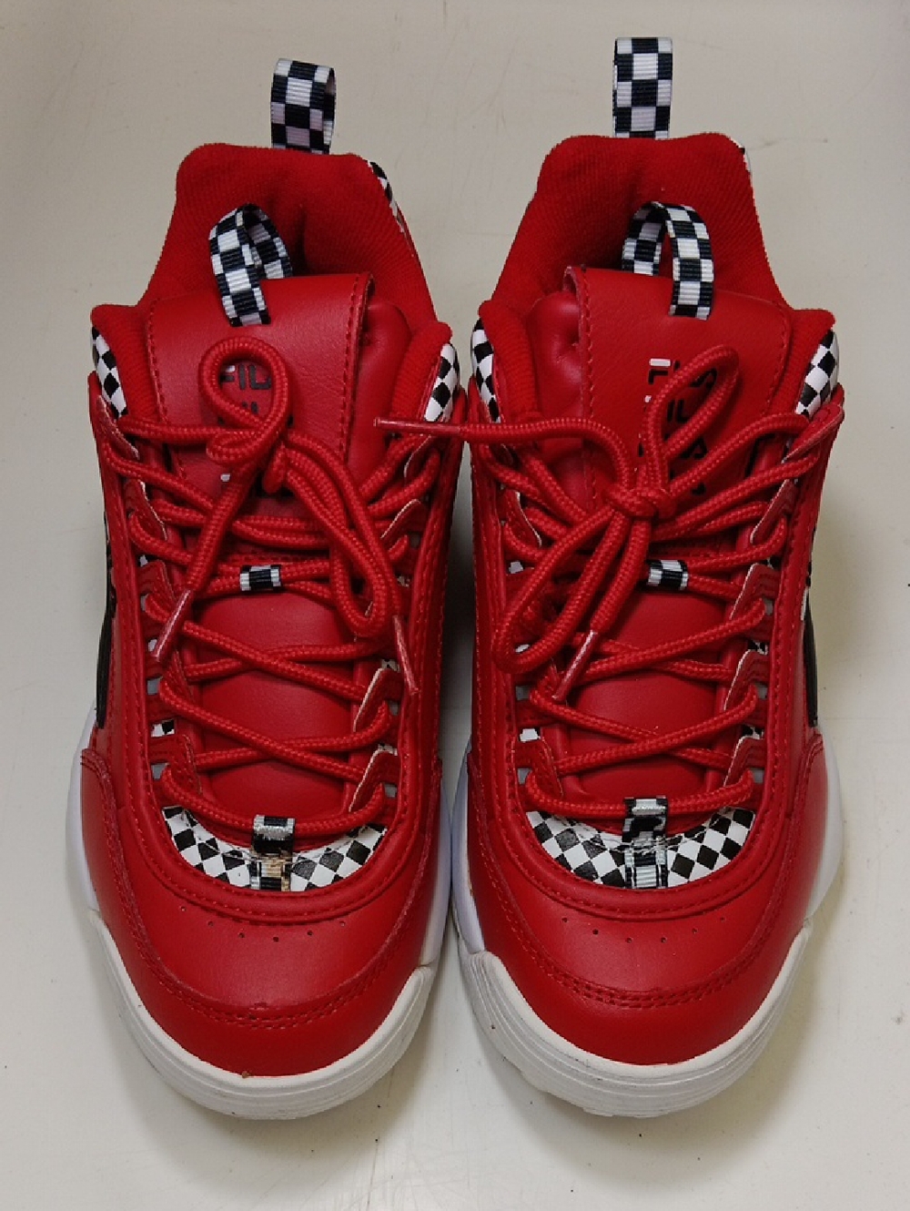Fila Red Sneakers with Black-and-White Checker Accents
